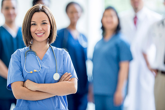 Doctor happy with Cloud-based solutions in healthcare.